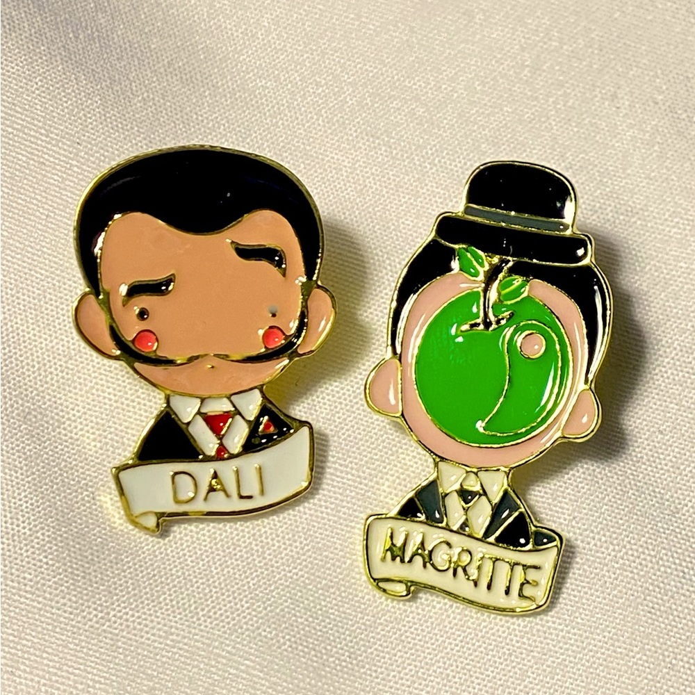 Magritte and Dali enamel brooches. Set of 2 pins. Artist tie tack pins. NEW